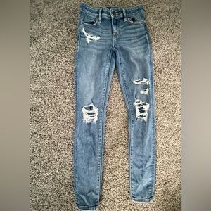 Closed ripped blue jeans